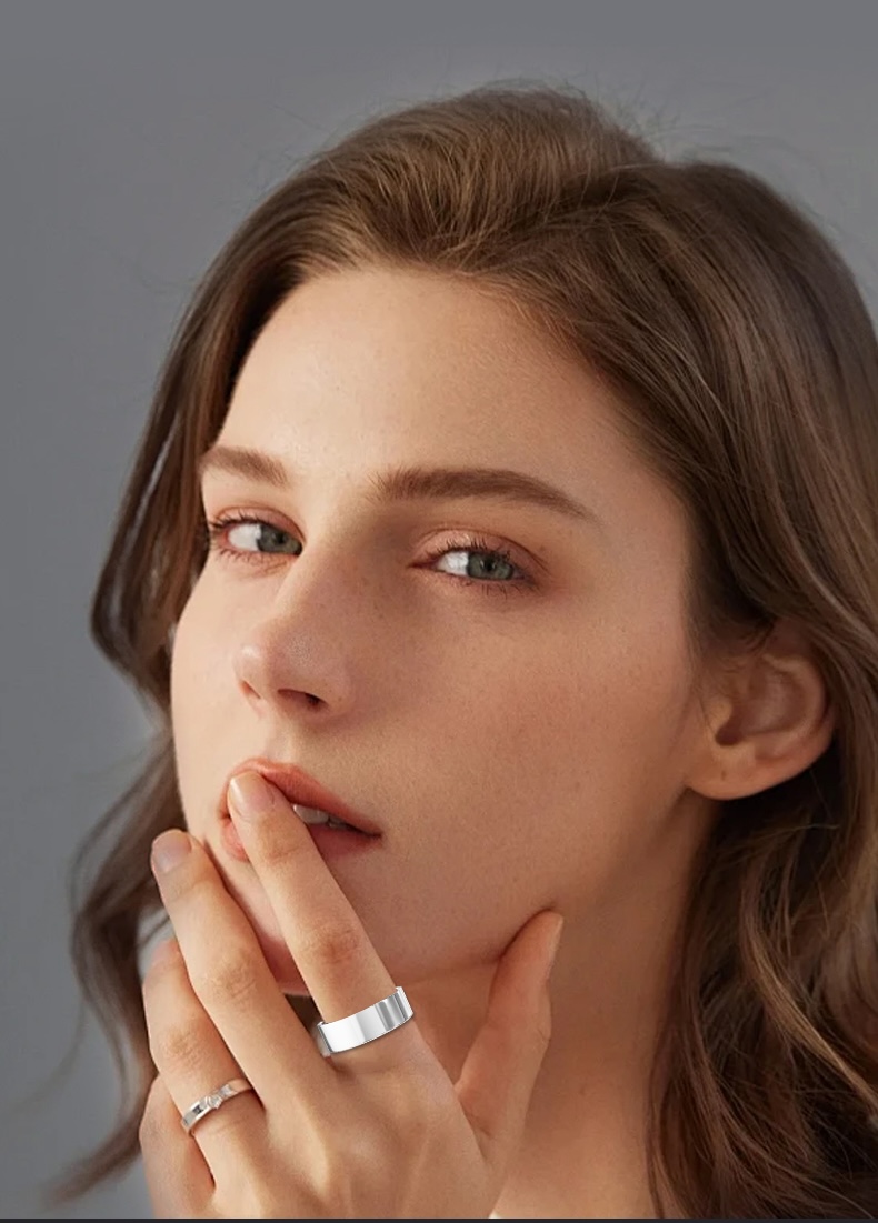 Person wearing the FoodTrack Loop smart ring in a calm, everyday moment